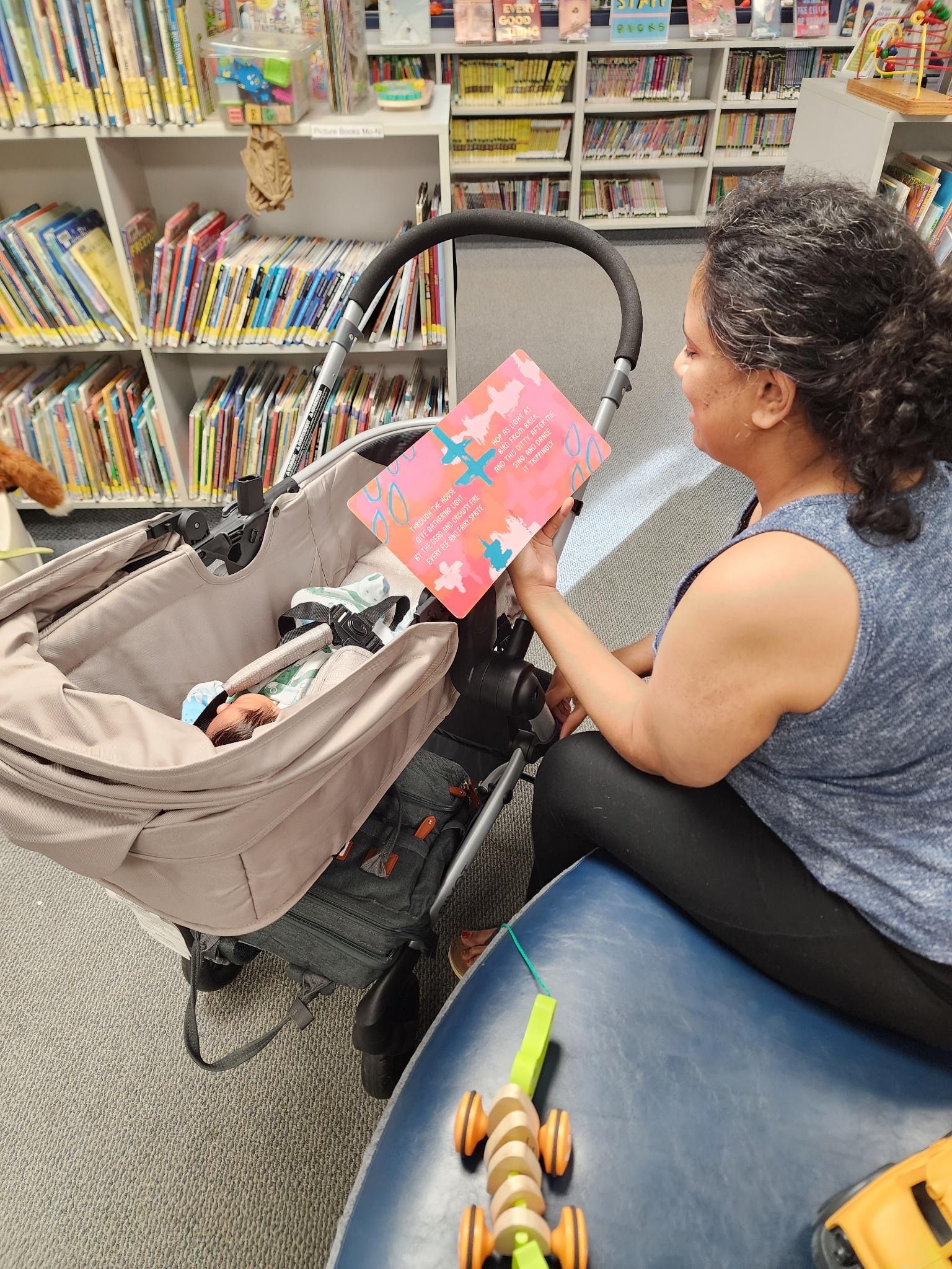 Mom Reading to a Baby